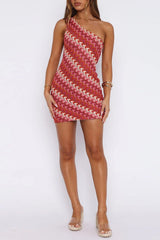 Full-length view of a model in a red and pink one-shoulder knit dress