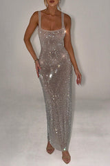 model posing in a sparkling floor-length dress
