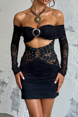 Woman wearing a black off-the-shoulder lace dress with long sleeves and a cut-out detail.
