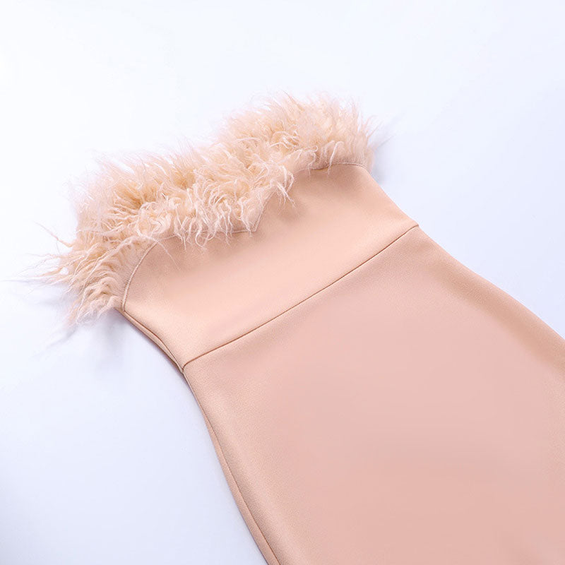 close-up of the feather trim at the neckline of a pale pink dress