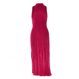 Back view of a woman in a deep pink sleeveless maxi dress with a mock neck and ribbed texture, showcasing her hairstyle