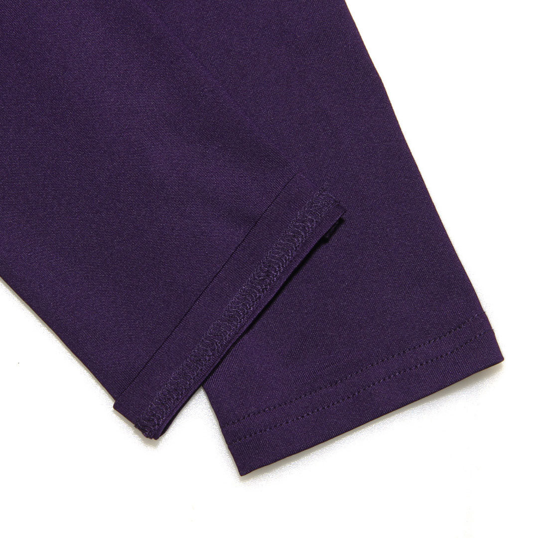 Close-up of the fabric and stitching on the sleeve of a purple dress.