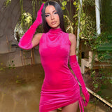 Model wearing a bright pink velvet mini dress with long matching gloves.