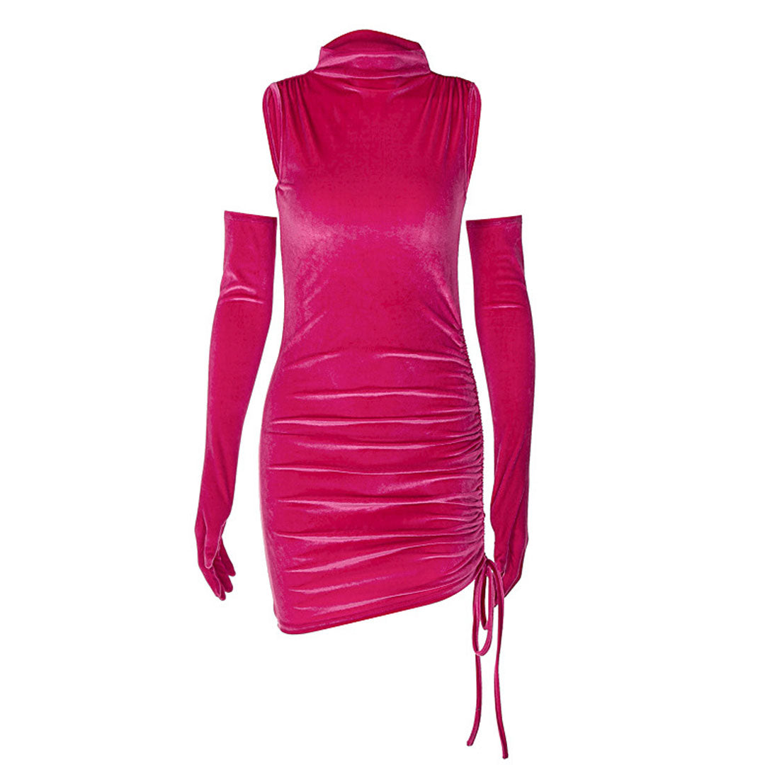 Close-up of a pink velvet dress with a mock neck and ruched detailing.