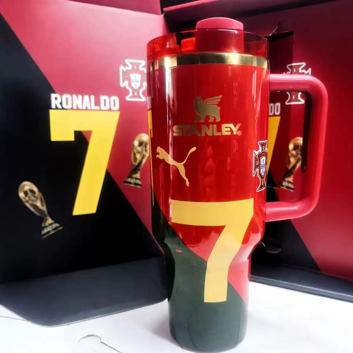 Stanley 40oz insulated tumbler featuring Cristiano Ronaldo number 7 design, red body with gold accents, includes matching Ronaldo-themed gift box