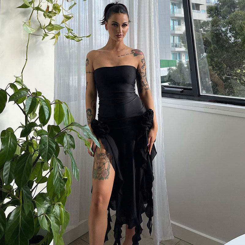 woman in a black strapless dress with floral detail