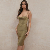 woman wearing a satin olive green midi dress with a corset bodice and spaghetti straps, angled front view