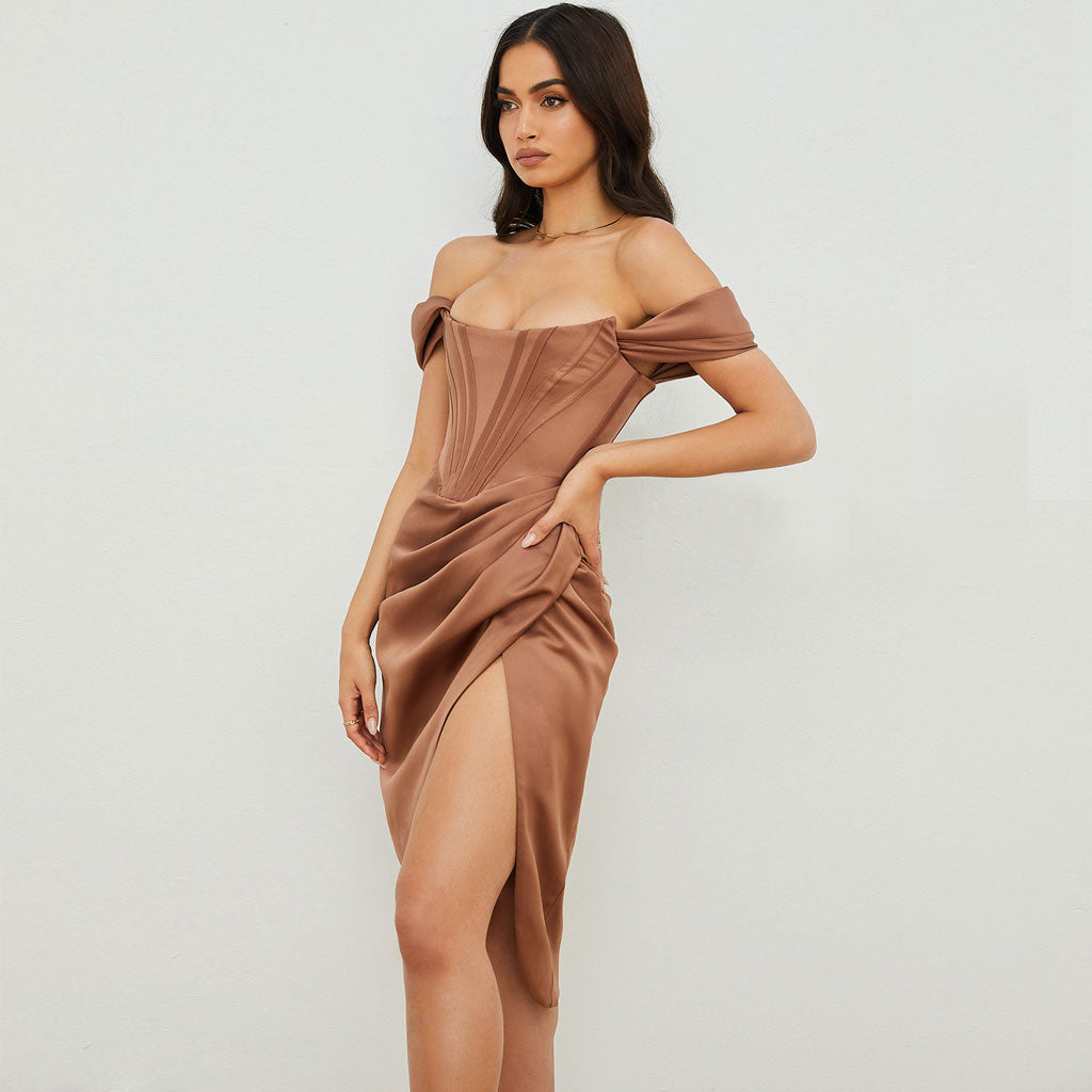 Side profile of a woman in an elegant brown satin dress, showcasing the ruched detailing and high slit.