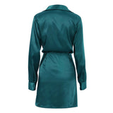 Back view of a teal satin long sleeve wrap mini dress