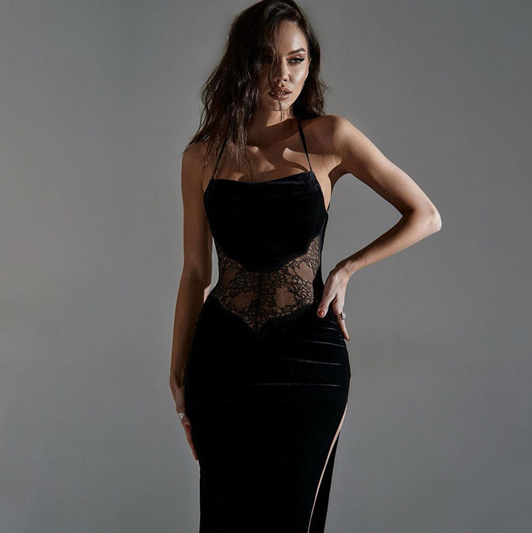 Close-up of a woman wearing a black velvet gown with lace bodice.