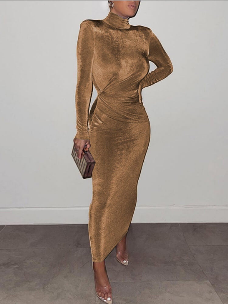 Woman wearing a long-sleeved bronze velvet dress with a high neckline and ruched detailing.