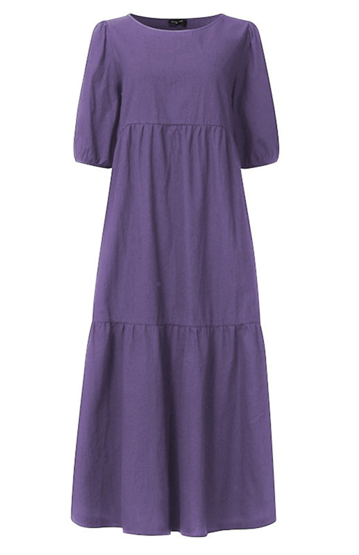 Front view of a purple tiered midi dress with puff sleeves