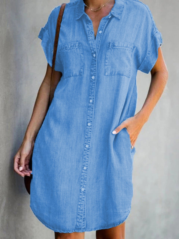 woman wearing a blue denim short-sleeve shirt dress with a collared neckline and button-down front
