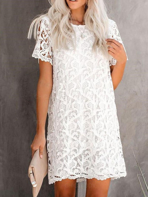 front view of a woman wearing a white lace mini dress with short sleeves