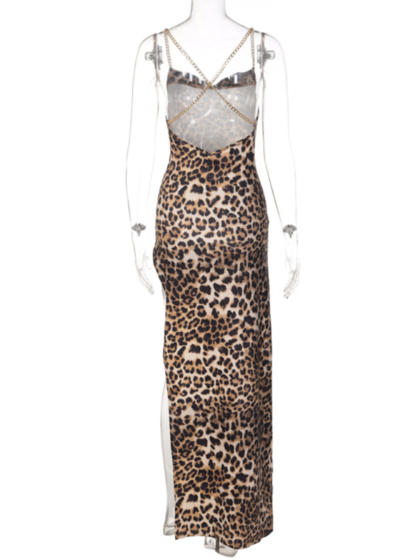 Back view of a leopard print maxi dress with a high slit and chain detail straps.