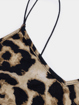 Close-up of the leopard print fabric and spaghetti strap detail on a dress