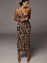Woman wearing a leopard print midi dress with spaghetti straps