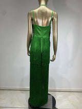 back view of a mannequin wearing a long green halter neck dress with tiered fringe and a high leg slit