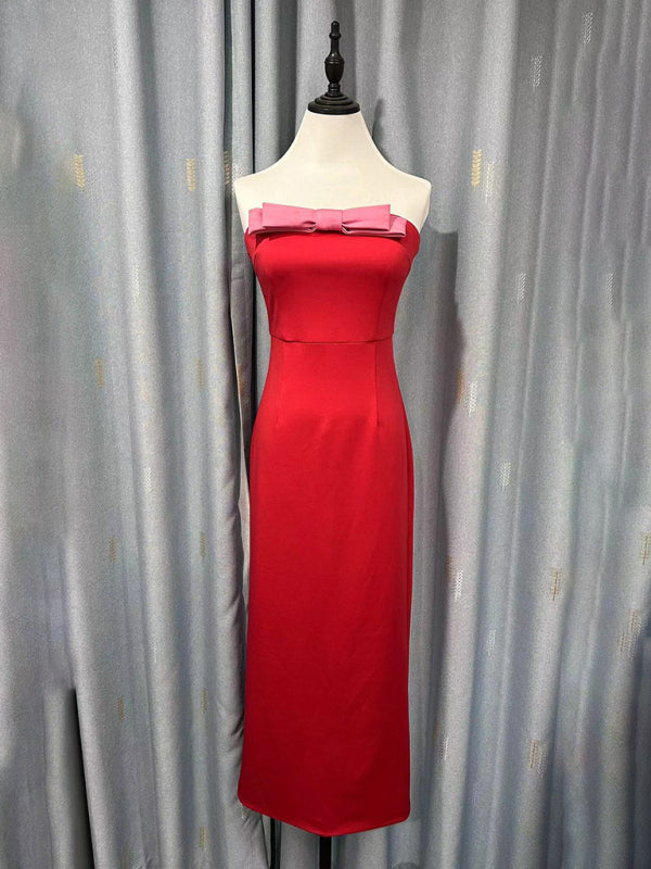 Red strapless midi dress with a pink bow accent displayed on a mannequin.