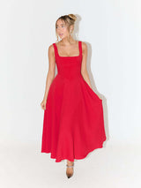 woman in red fit and flare midi dress with square neckline