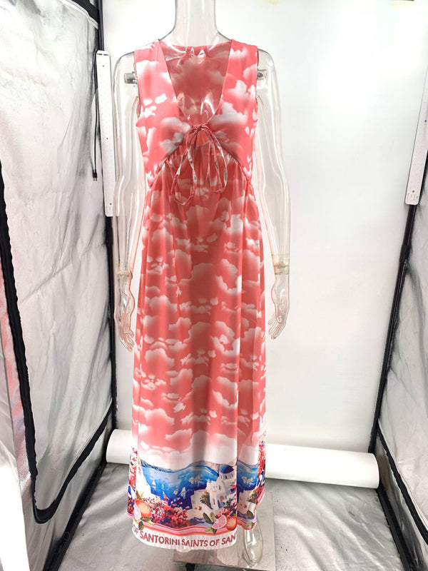 Front view of a pink sleeveless maxi dress with a cloud print on a mannequin.