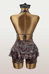 Back view of a leopard print halter romper on a mannequin, revealing the tie-back closure.