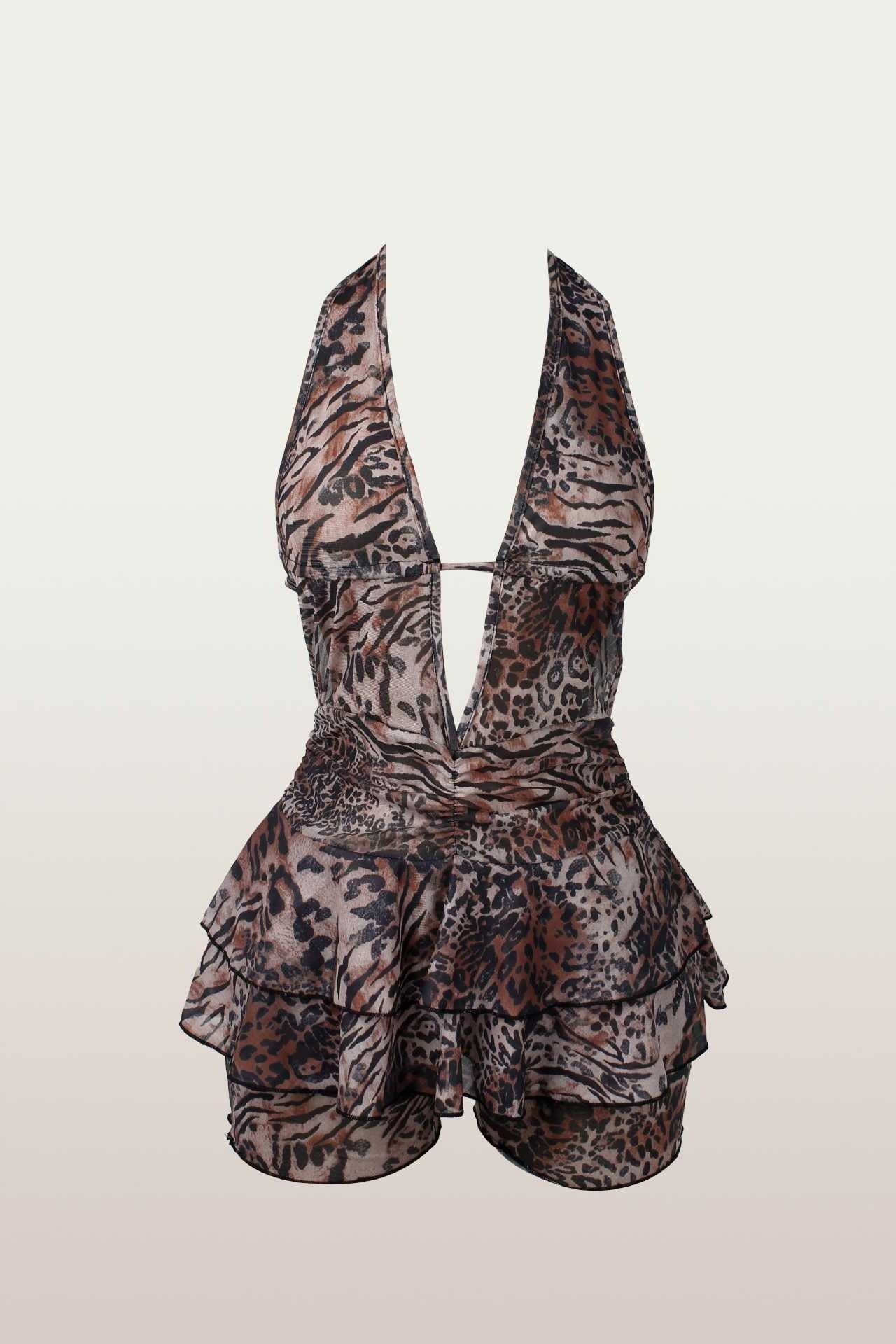 Front view of a leopard print halter romper with a deep V-neck and tiered ruffles.