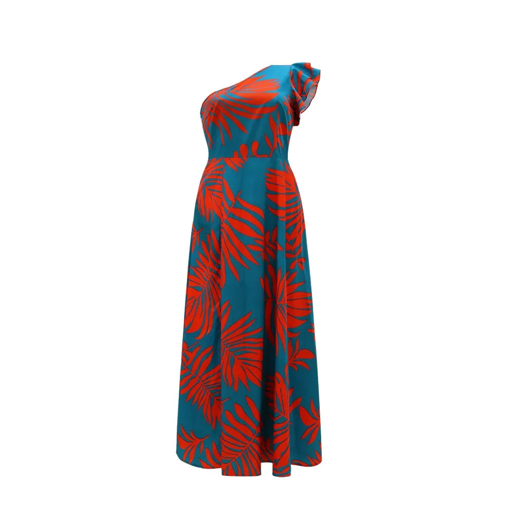Close-up of the teal and red tropical print on the shoulder of the dress.