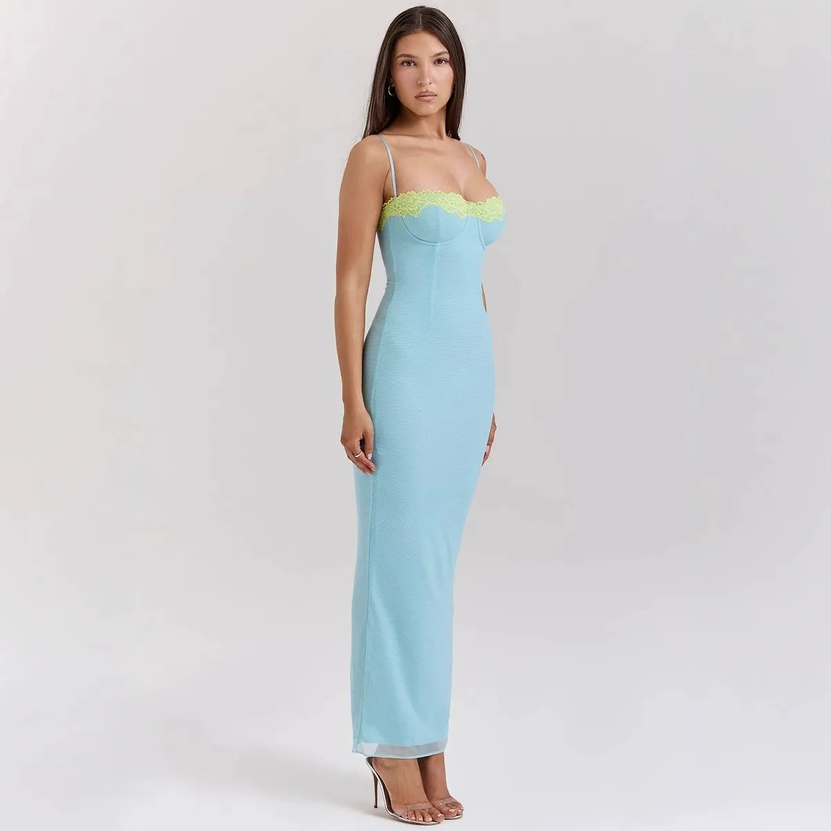 woman wearing a long light blue ribbed knit dress with lace trim