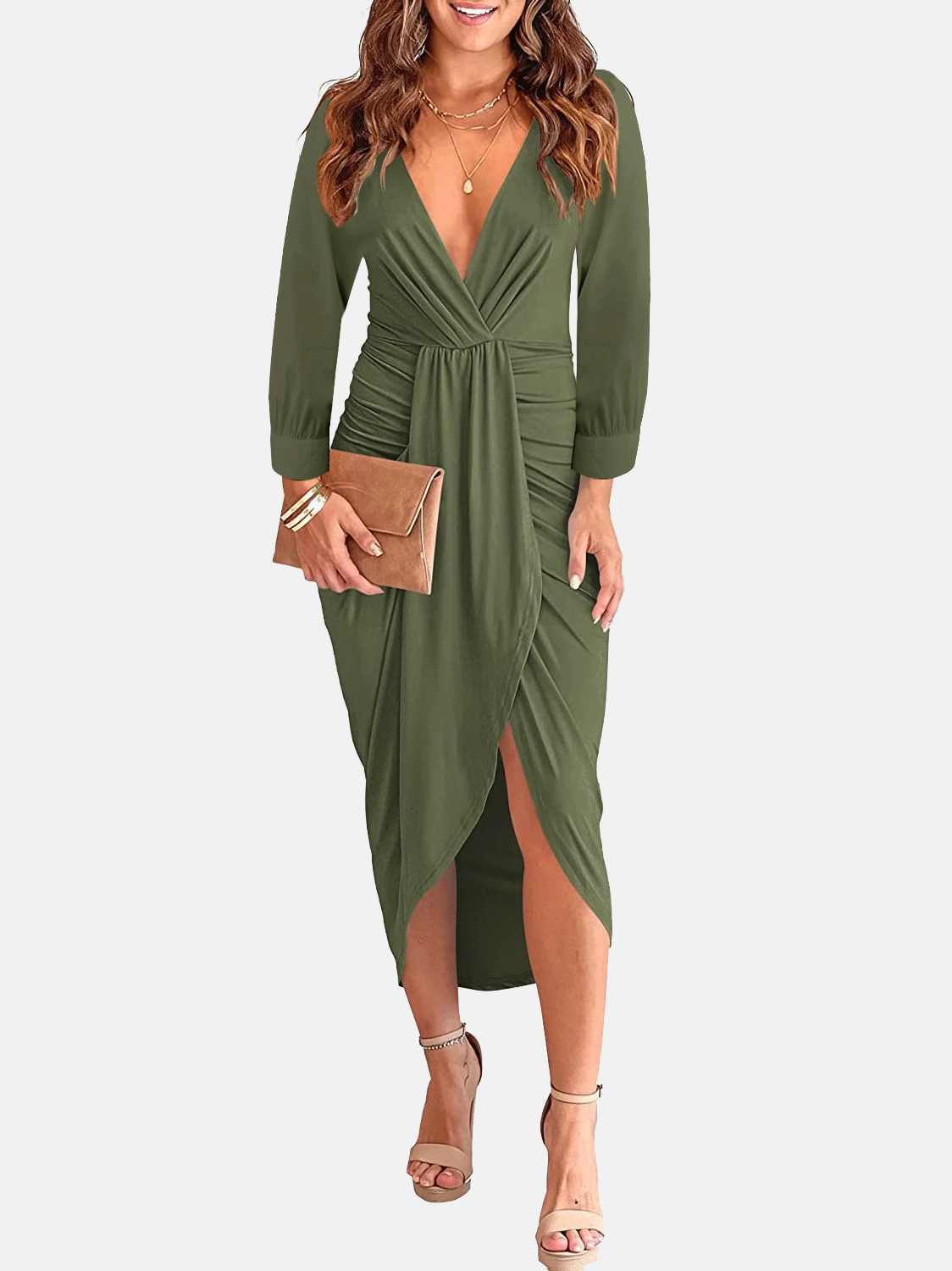 Woman wearing an olive green long-sleeve V-neck ruched waist dress with an asymmetrical hem and a clutch bag.