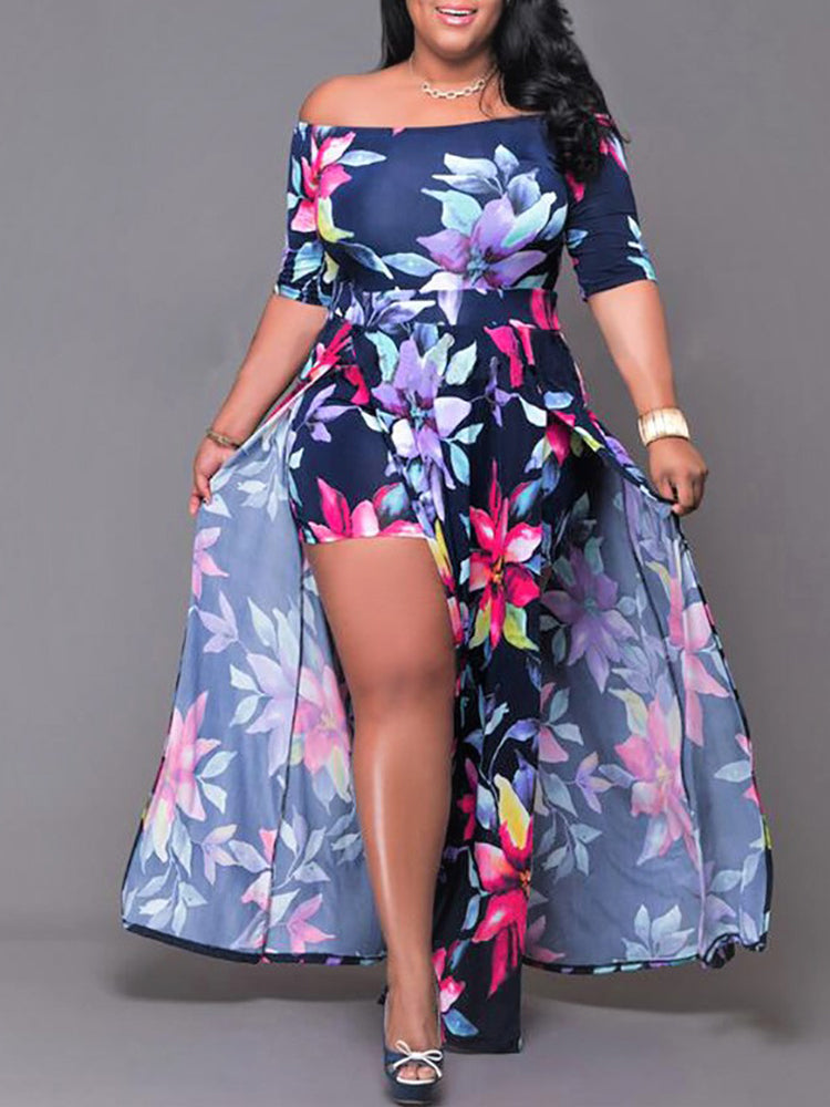 Woman wearing a navy blue floral print off-the-shoulder maxi dress with a high leg slit and integrated shorts.