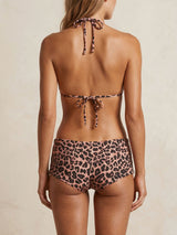 Back view of a woman wearing a leopard print bikini set.