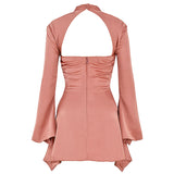 Back view of a rose gold satin mini dress with a cut-out neckline and flared sleeves