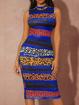 Woman wearing a sleeveless mock neck bodycon sheath dress with an abstract stripe and leopard print pattern, front view.
