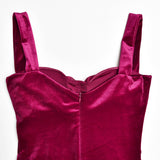 close-up of the bodice and zipper of a burgundy ruched velvet and mesh dress