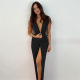 Woman in a black sleeveless maxi dress with a deep V-neckline and a high slit