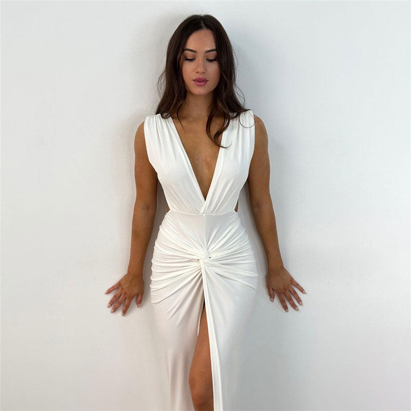 woman wearing white ruched maxi dress with deep V-neck
