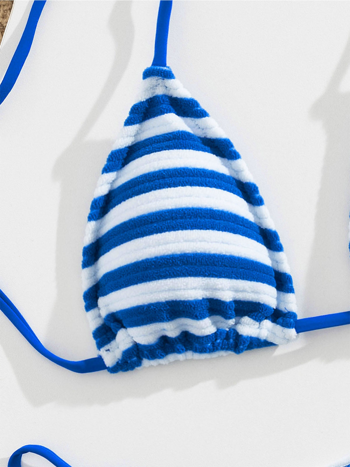 Close-up of the blue and white striped bikini top