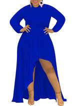 Woman wearing a royal blue long-sleeved, high-low hemline dress.