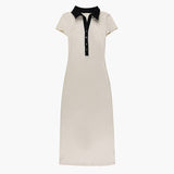 Cream knit midi dress with a black polo collar and short sleeves, featuring a button-up placket and a bodycon silhouette.