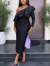 Woman wearing a black one-shoulder dress with ruffle detail and lace skirt, holding a purple clutch.