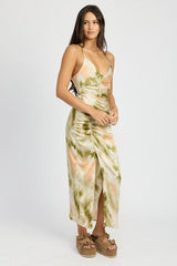 side view of a woman wearing a tie-dye slip dress