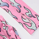 Close-up of the sleeve detail on a pink flame print dress