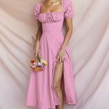 Close-up of the bodice of a pink midi dress, showing the square neckline and drawstring detail.