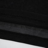 close-up of the black mesh fabric and stitching of the dress