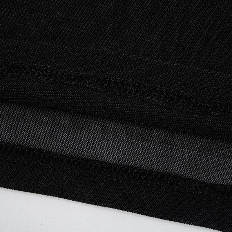 close-up of the black mesh fabric and stitching of the dress