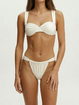 Front view of a white bikini set on a model