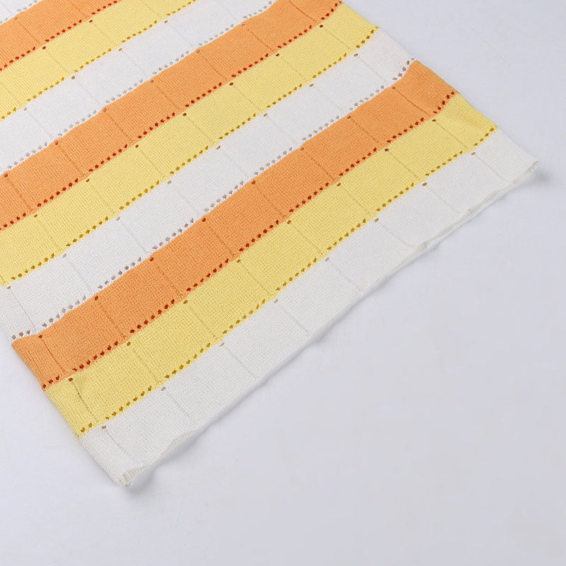 Close-up of the striped knitted fabric of the dress