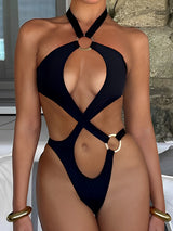 Front view of a black one-piece swimsuit with cut-out details and ring hardware