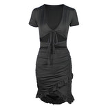 front view of a black short-sleeve ruched bodycon dress with a tie-front neckline and ruffled hem